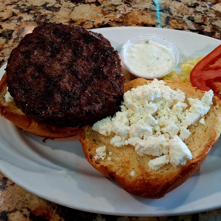 Indulge in Our Greek Burger