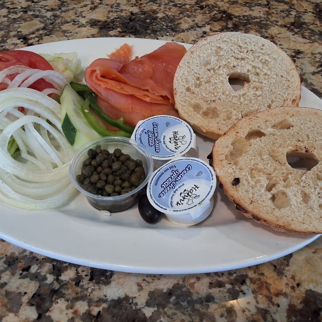 Bagel with Nova Scotia Lox, Cream Cheese, Lettuce, Tomato & Onion.